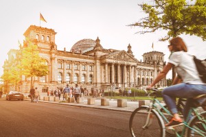 Berlin urban city life with Reichstag at sunset in summer, Germany - Emigrate2